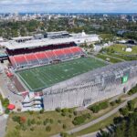 Aerial view of Lansdowne Park showing TD Place stadium, the Aberdeen Pavilion, the Rideau Canal and downtown Ottawa.