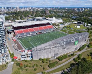 Aerial view of Lansdowne Park showing TD Place stadium, the Aberdeen Pavilion, the Rideau Canal and downtown Ottawa.