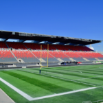 The north side stands at TD Place under a clear sky, with the Aberdeen Pavilion roof behind them.